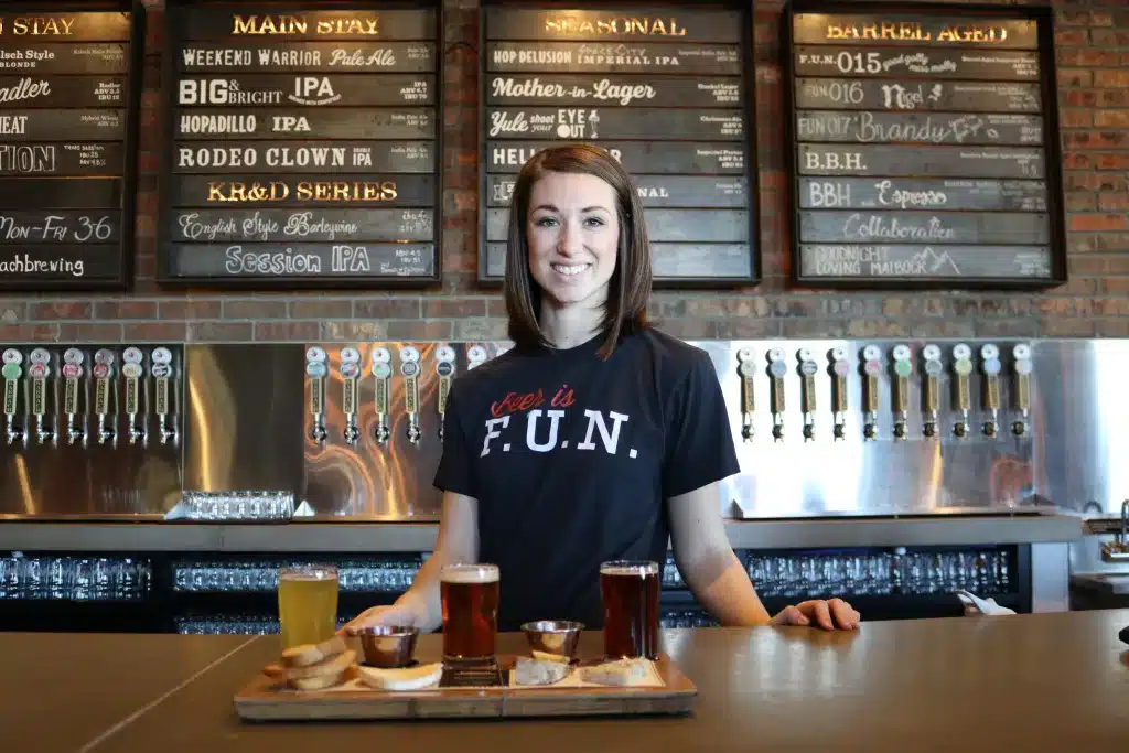 small business owner standing behind counter in her cafe