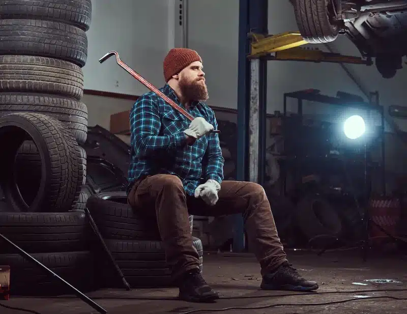 A Mechanic in his Motor Garage with a Card Machine